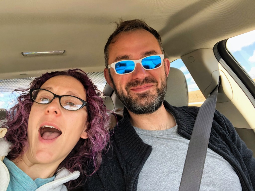 A selfie that Laura took while we were sitting in the car on our first day on the road. We're both looking pretty chipper. It's pretty obvious that my head is close to the ceiling, since static electricity is pulling strands of my hair straight up. 