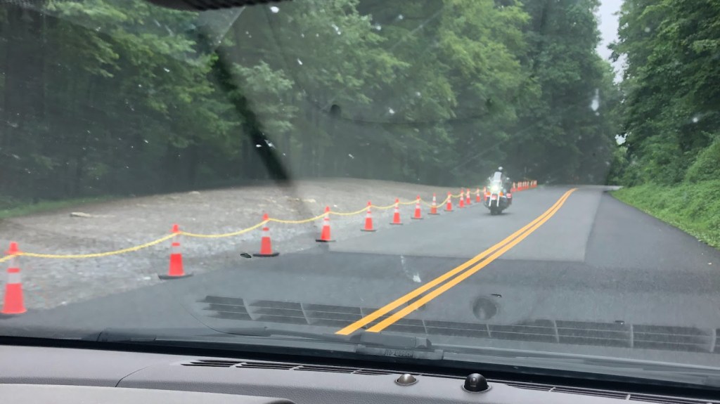 Cones line the side of the road.