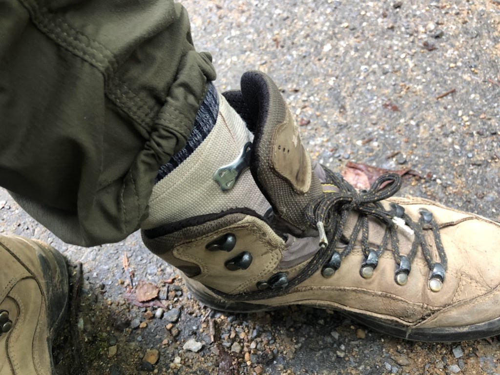 Laura's foot, showing an elastic wrapped ankle stuffed into an unlaced boot. It looks very pathetic.