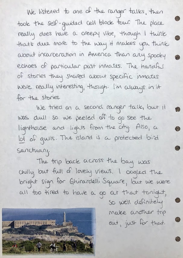 A photo of a handwritten journal page. a photo cut from a brochure is pasted in the bottom left corner, showing a view of the buildings on Alcatraz Island, including the cell block and lighthouse. A full transcription of the writing is below. 
