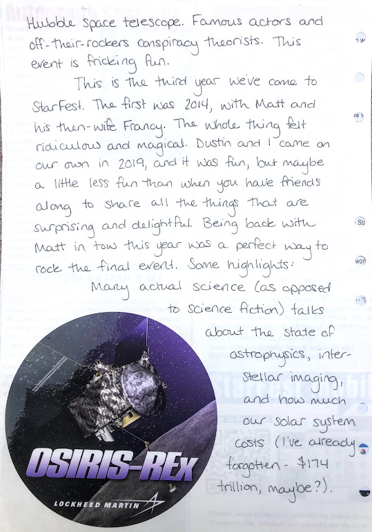 A photograph of a hand-written journal page. The handwriting is in black ink. A round sticker titled OSIRUS-REx Lockheed Martin and depicting an artist's rendering of that satellite is in the lower left corner of the page. 