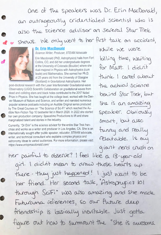 A photograph of a hand-written journal page. The handwriting is in black ink. A bio of Dr. Erin MacDonald cut out of the program booklet, including her photo, is pasted on the left side of the page surrounded by tiny hand-drawn hearts. A full transcription of the bio is at the bottom of the blog post.