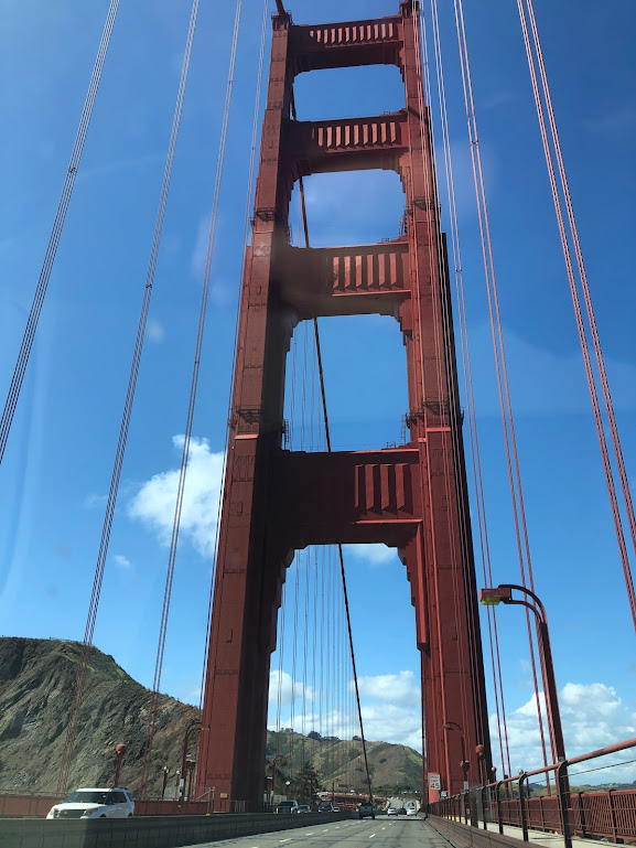 Vertical closeup photo of one of the Golden Gate Bridge's support structures, taken from nearly right below it, through the windshield of a moving car. Needless to say, it is not a very artful image.